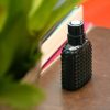Eau de Parfum -Perfume Hombre Roma sobre mesa